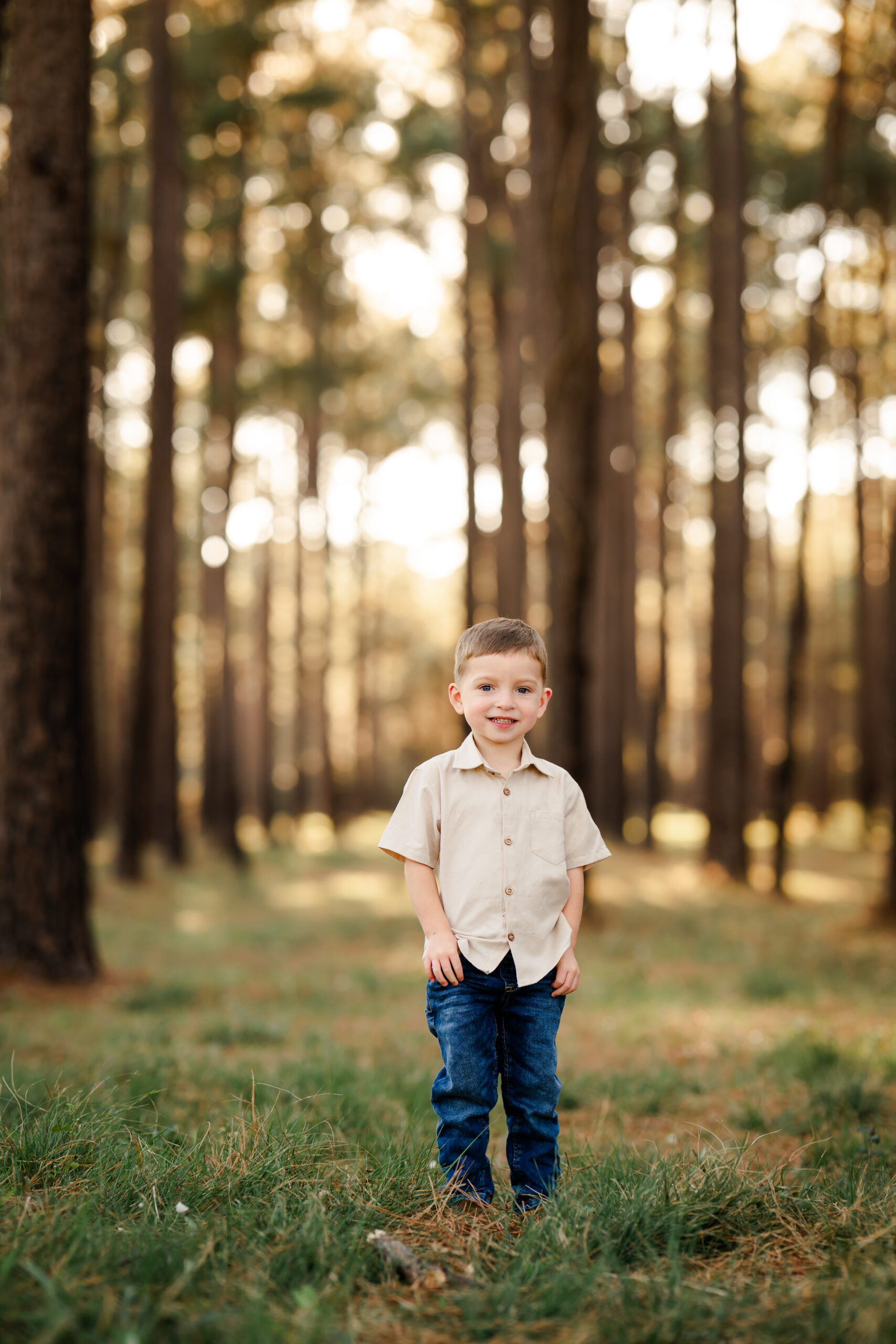 A picture of a young boy standing inWG Jones State Forest.