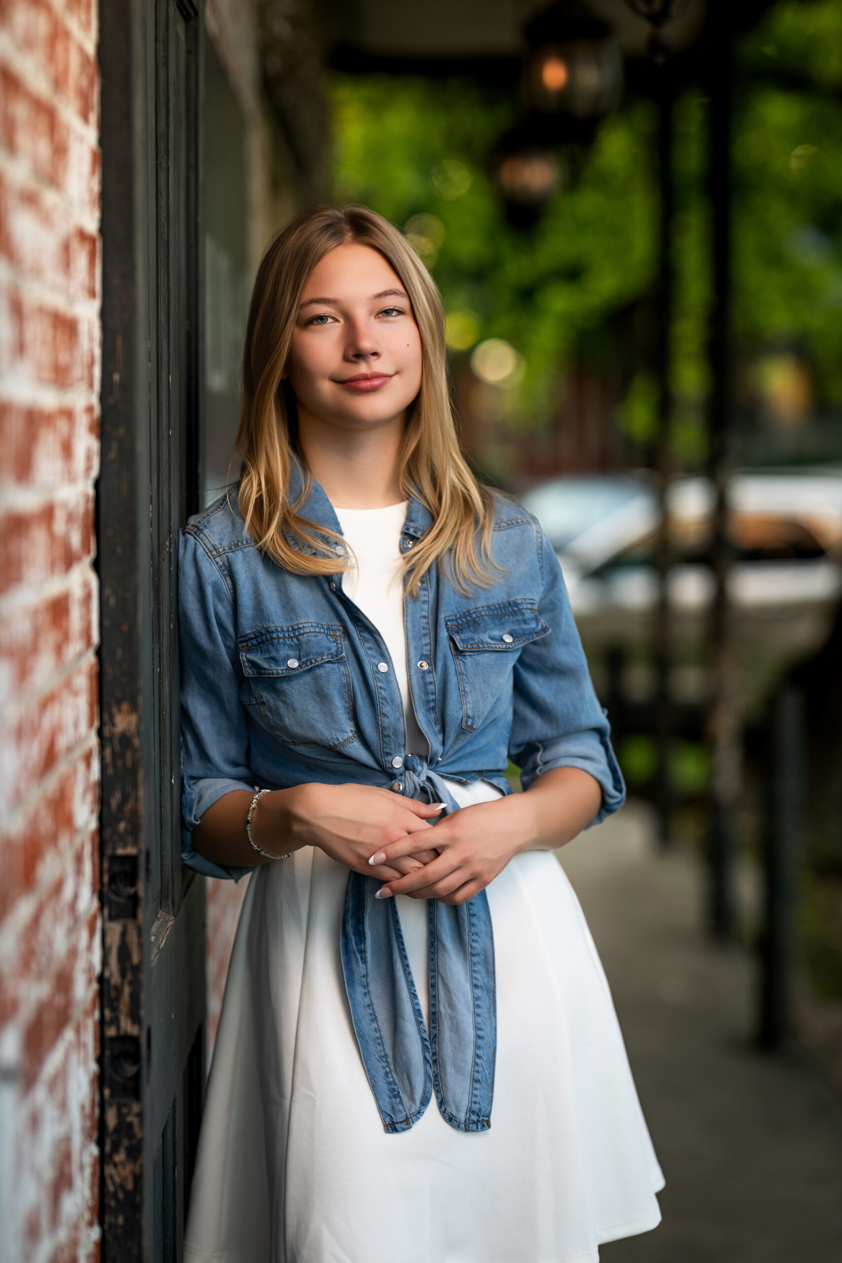 Picture of a high school senior leaning against a old door near Waller, Texas.