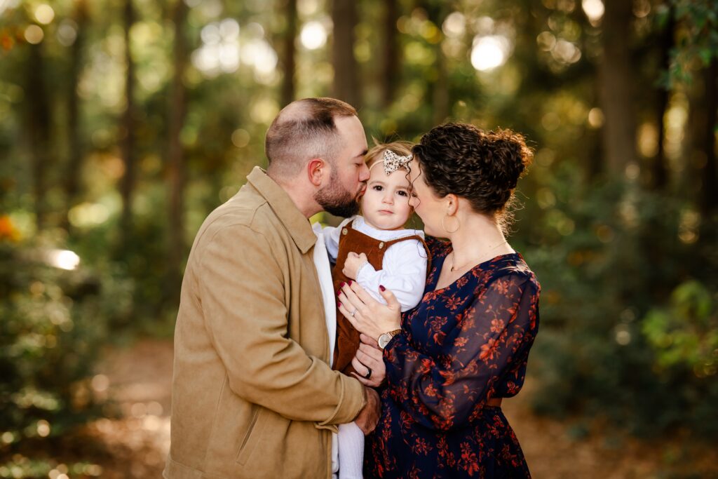 A picture of a family during their family photo session in Grogan's Mill, The Woodlands, Texas.