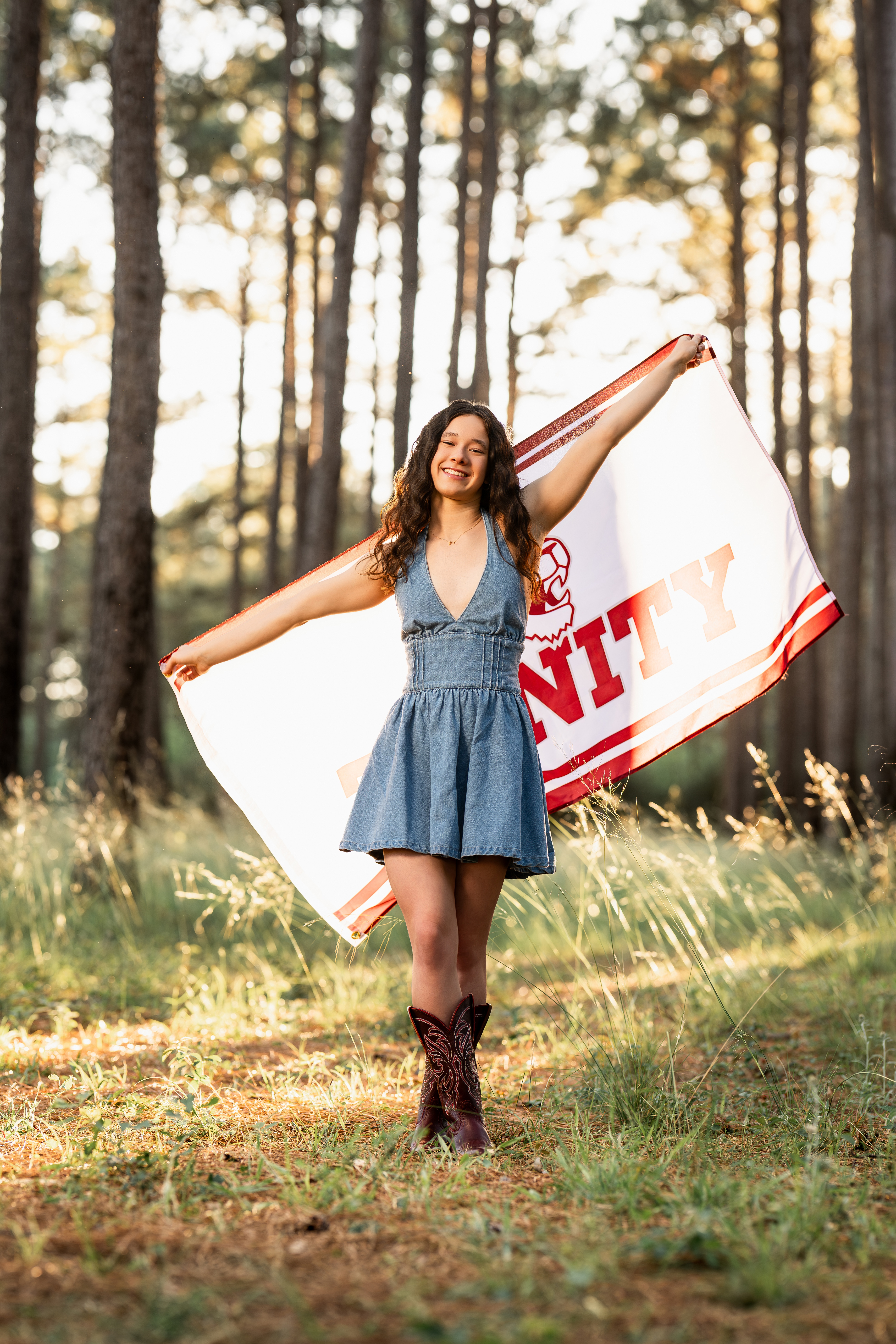 A picture of a high school senior in a forest near Cypress, Texas.